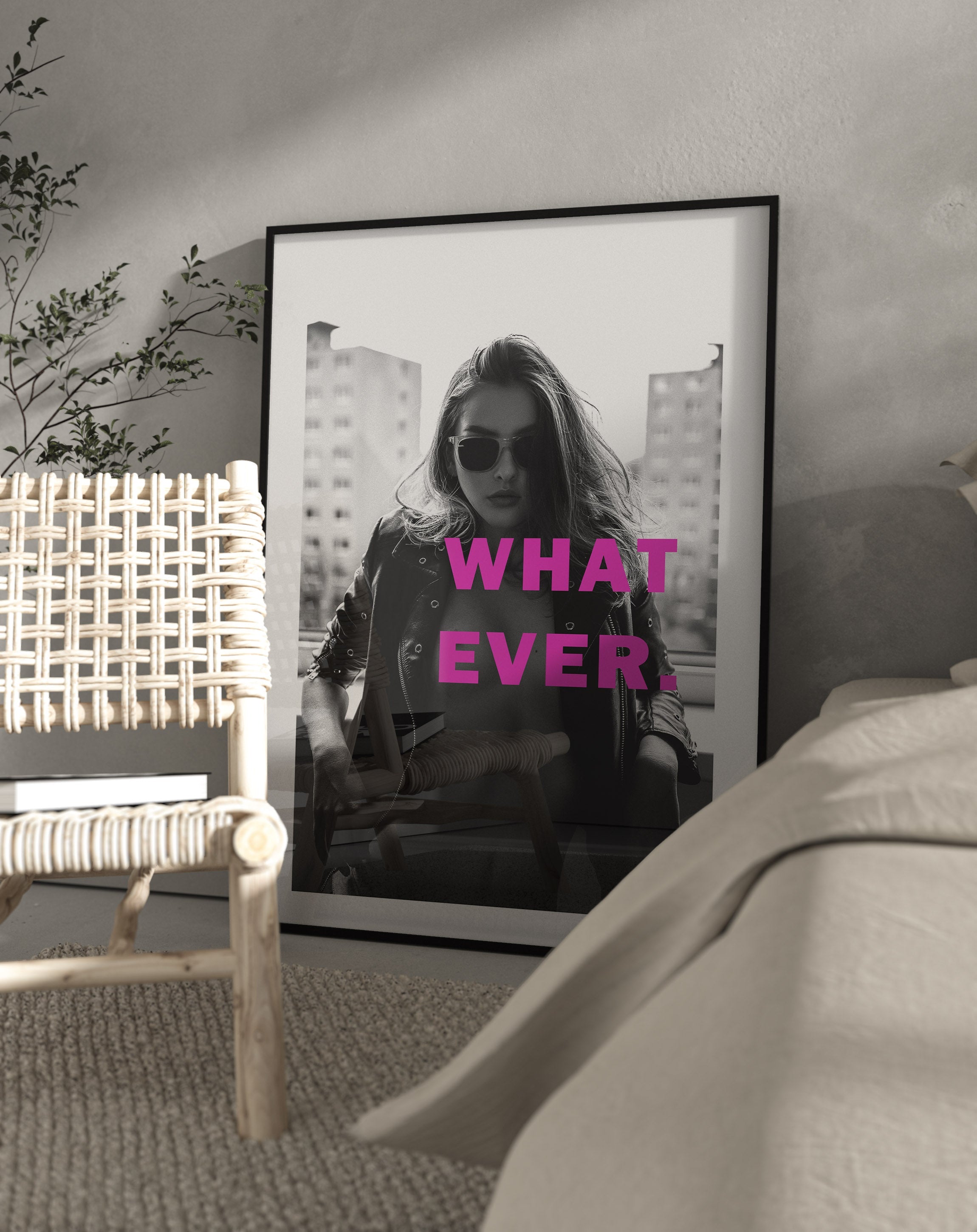 black and white poster of a woman posing with attitude half naked. the picture has pink text saying what ever.