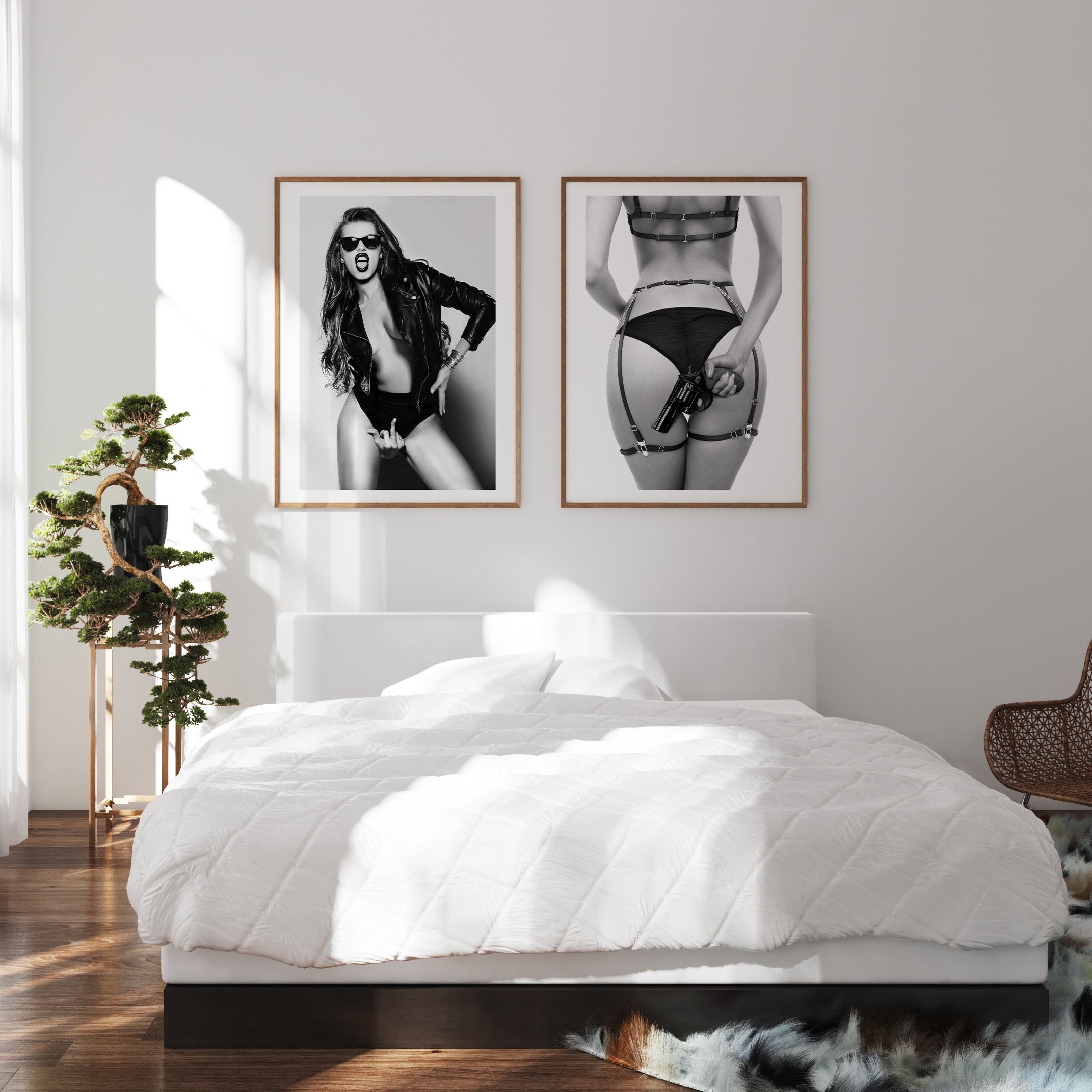 2 black and white posters of woman with gun and sunglasses
