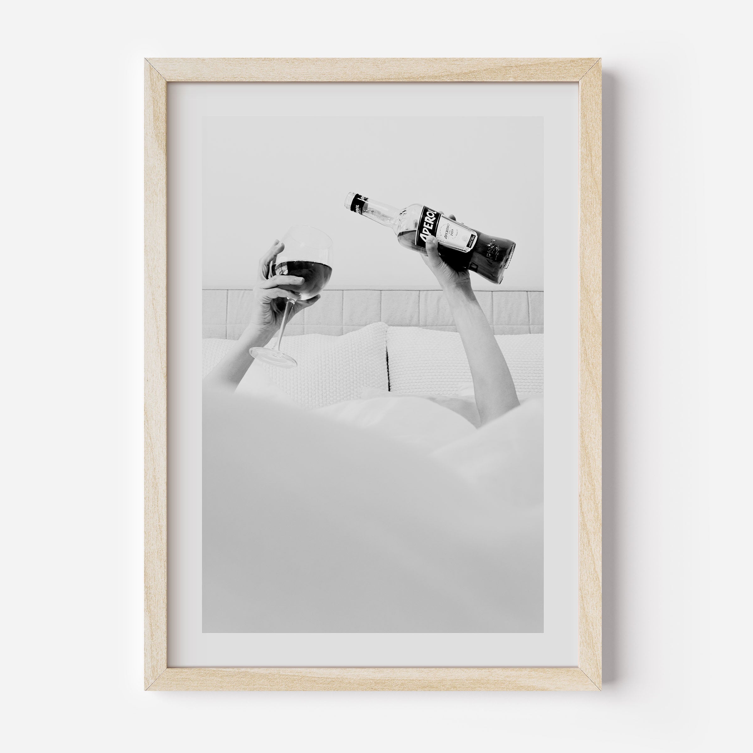 black and white poster of a woman drinking aperol in bed poster, home decor