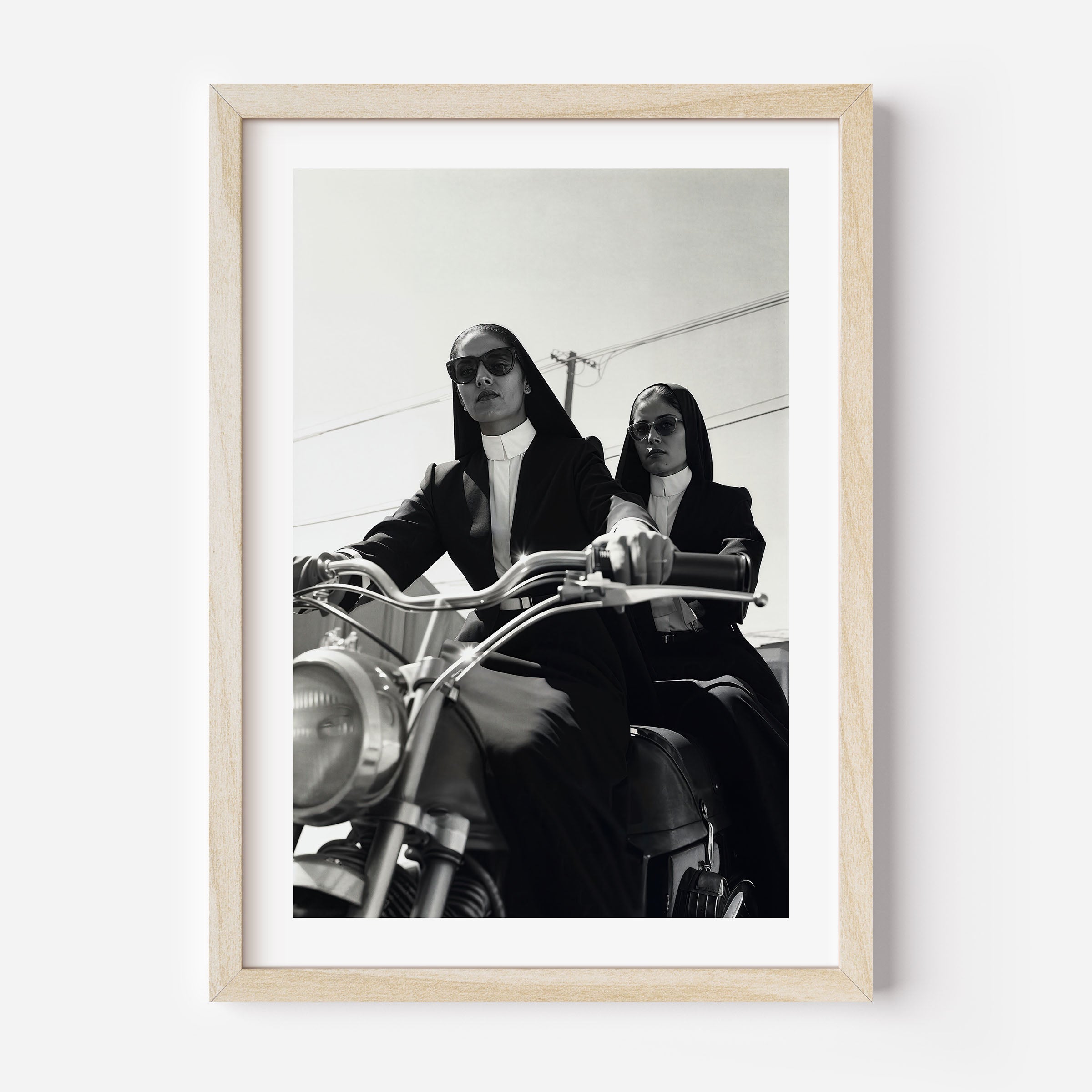 Fine art print of 2 cool nuns riding a motorbike. Black and white wall art/ poster