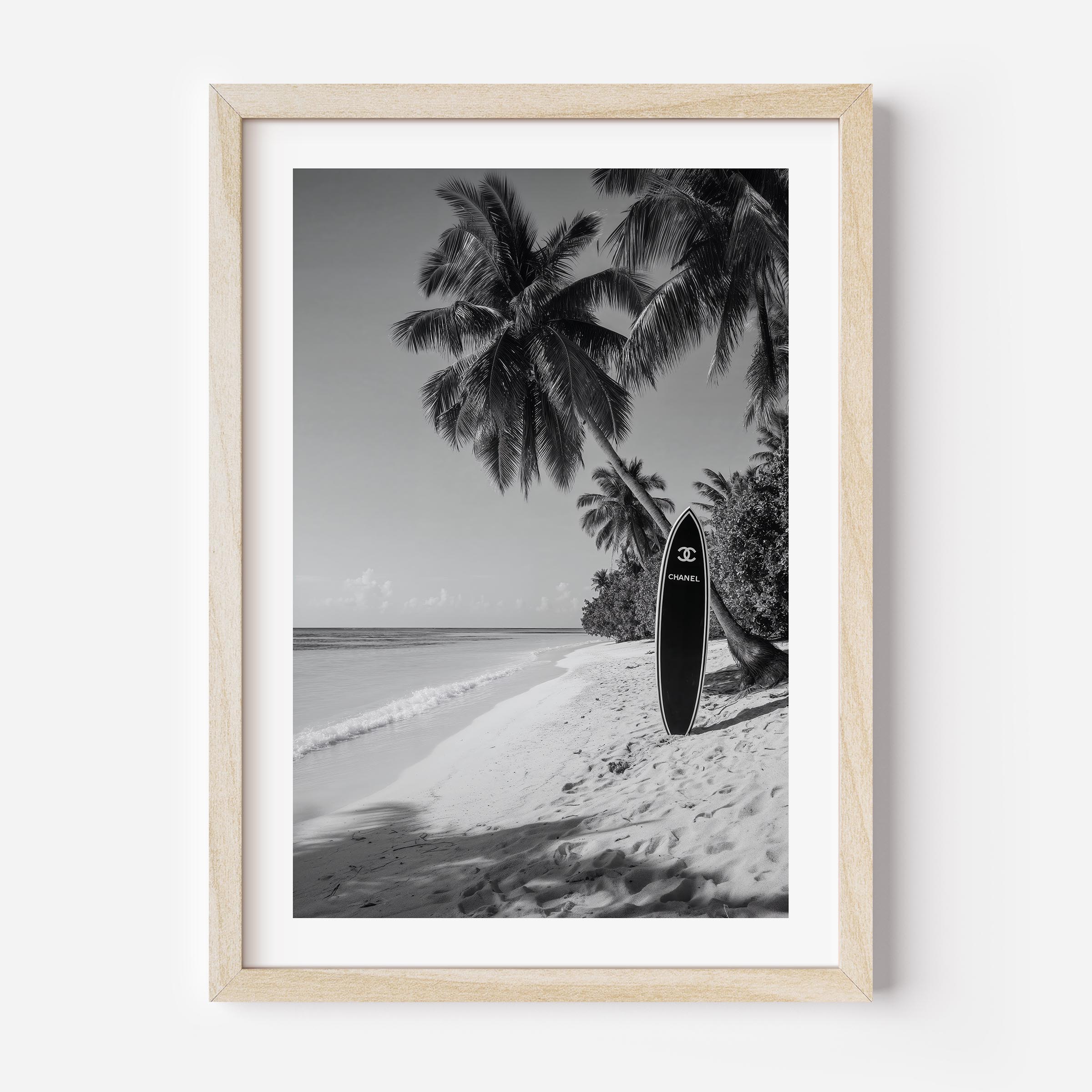 Luxury meets paradise in this black and white surfboard print. Elevate your walls with timeless fashion-inspired coastal art.