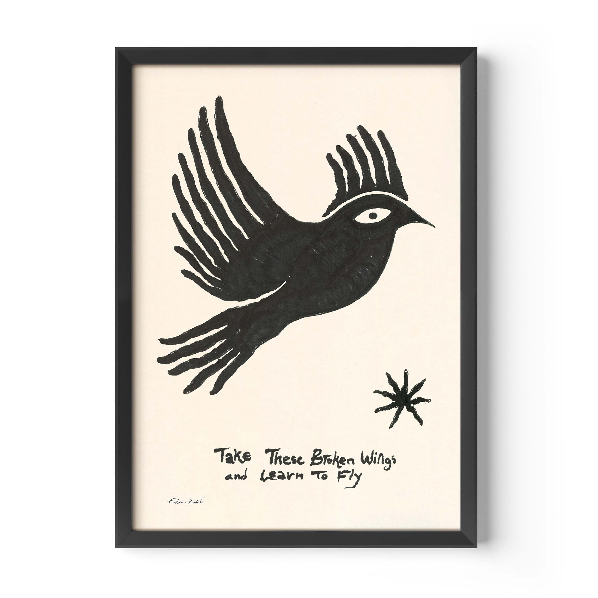 Framed art print by Eden Kalif featuring a bold black hand-drawn bird in flight on a cream background, with the handwritten text "Take These Broken Wings and Learn to Fly" and a small star motif. Printed on 230g matte paper in a black frame.