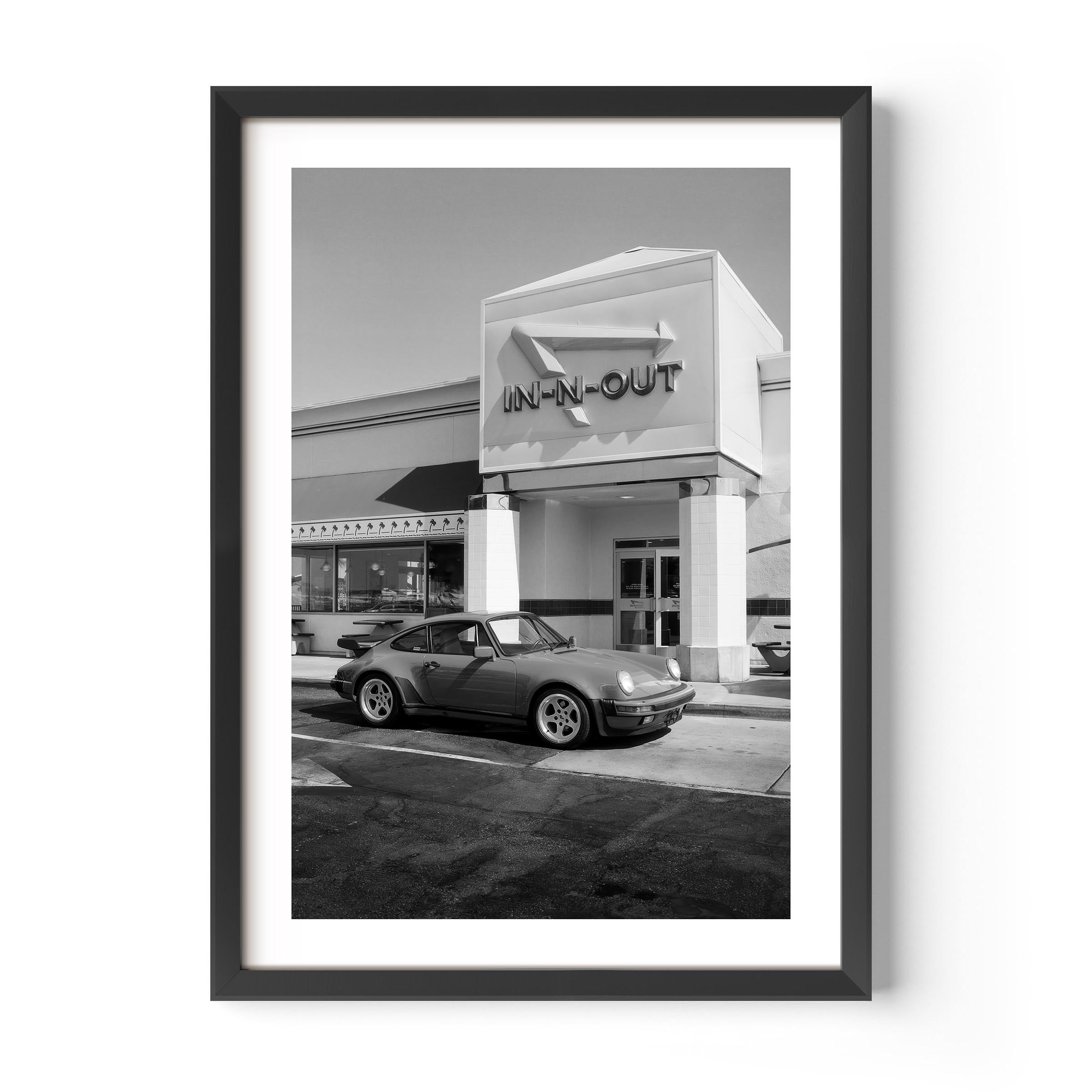 Black and white Porsche parked at In-N-Out – fine art wall print by Deston Isas.
