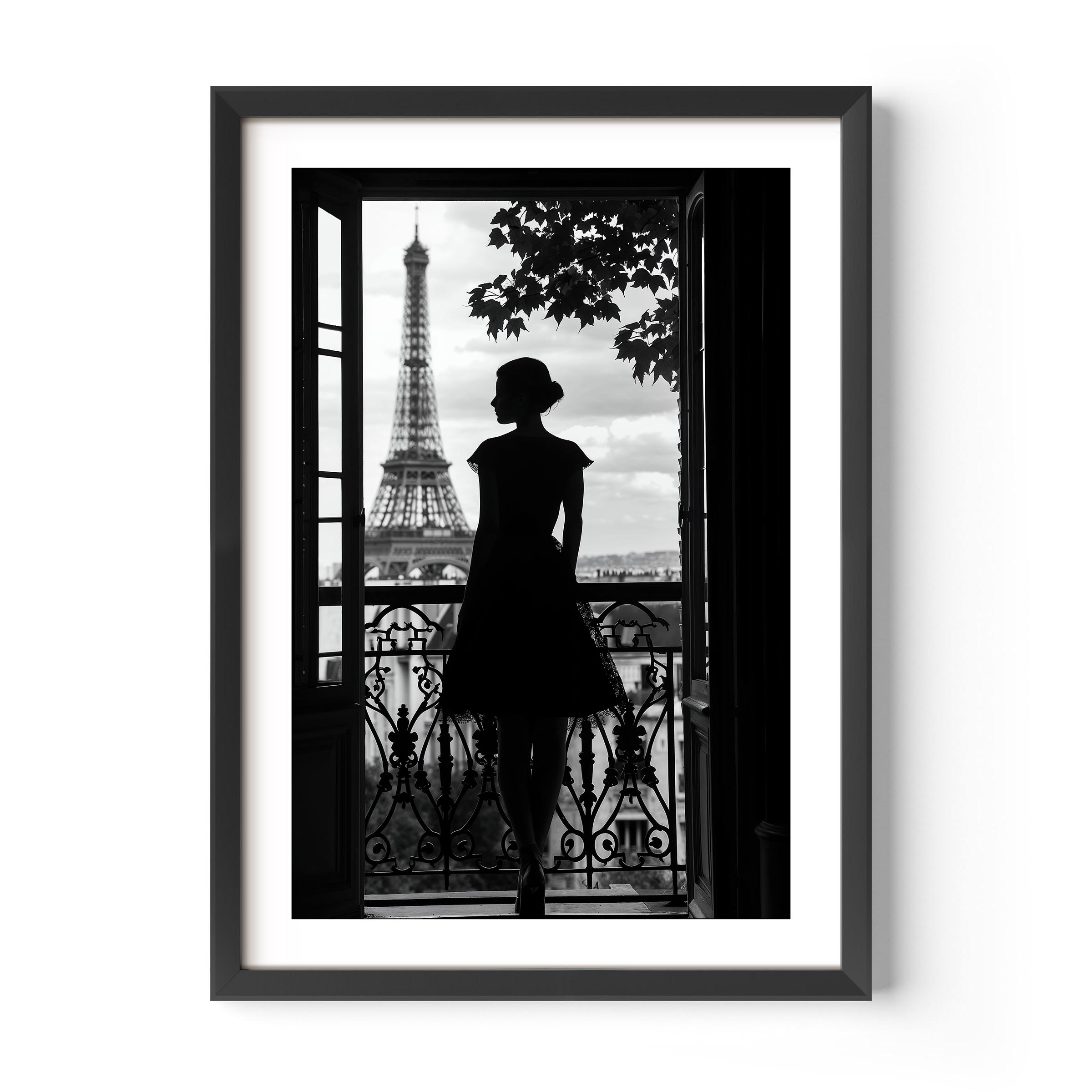 Black-and-white fine art photograph of a woman’s silhouette standing on a Parisian balcony with the Eiffel Tower in the background.