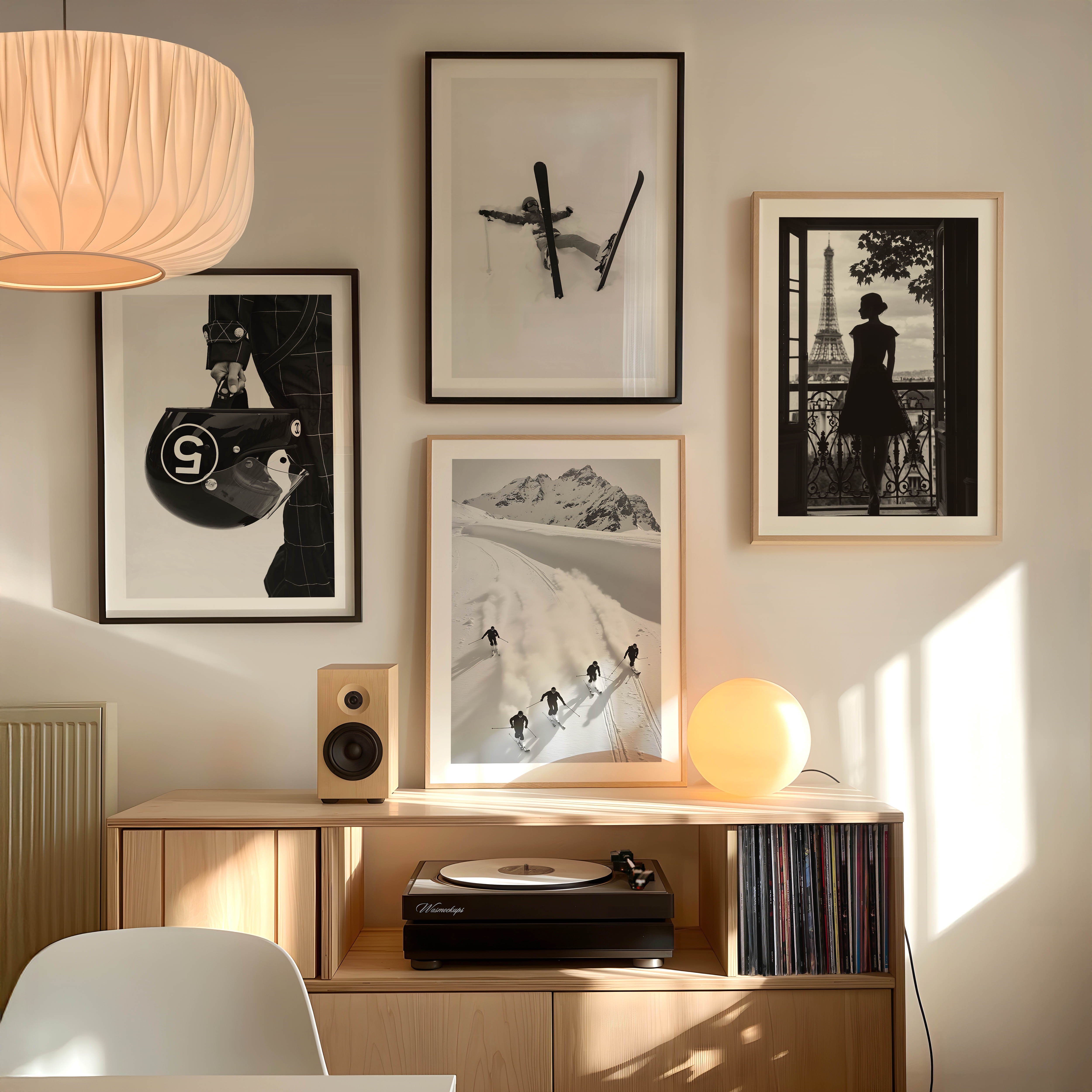 Black and white fine art print of a skier lying in deep snow with skis and pole scattered, framed in black.