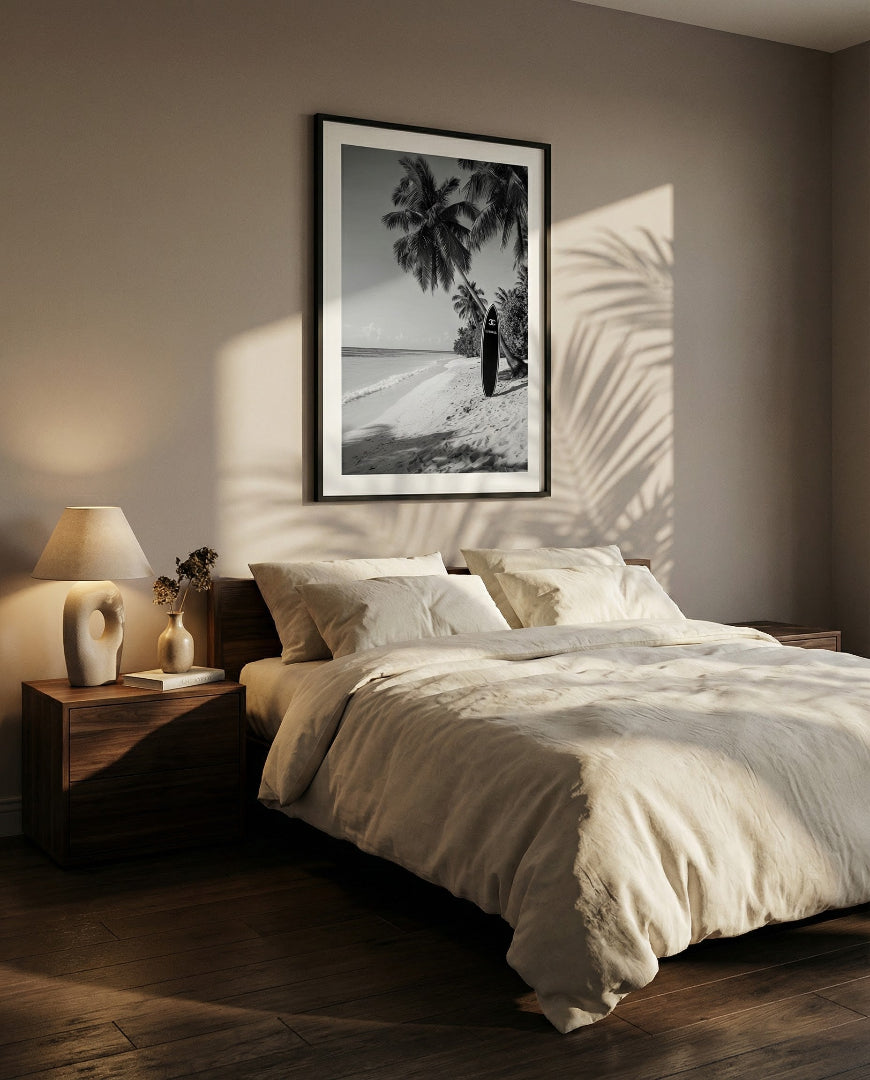black and white print of a surfboard on a beach with palmtrees