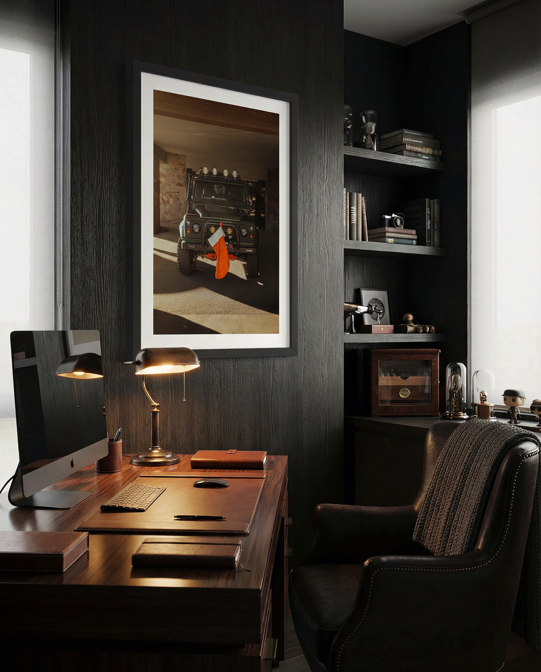 Fine art photo of a Land Rover Defender parked in a garage with warm sunlight, featuring a red Christmas stocking hanging from the front bumper.