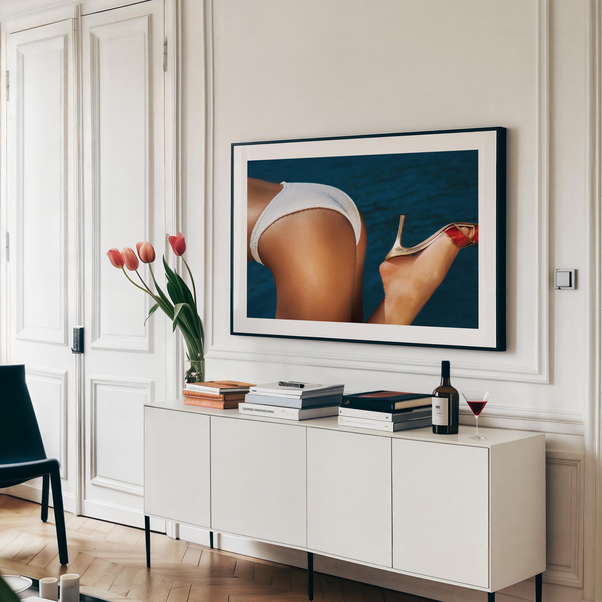 Close-up coastal photograph of a woman in a white bikini and a gold heel against deep blue water, by Britt van der Meijden