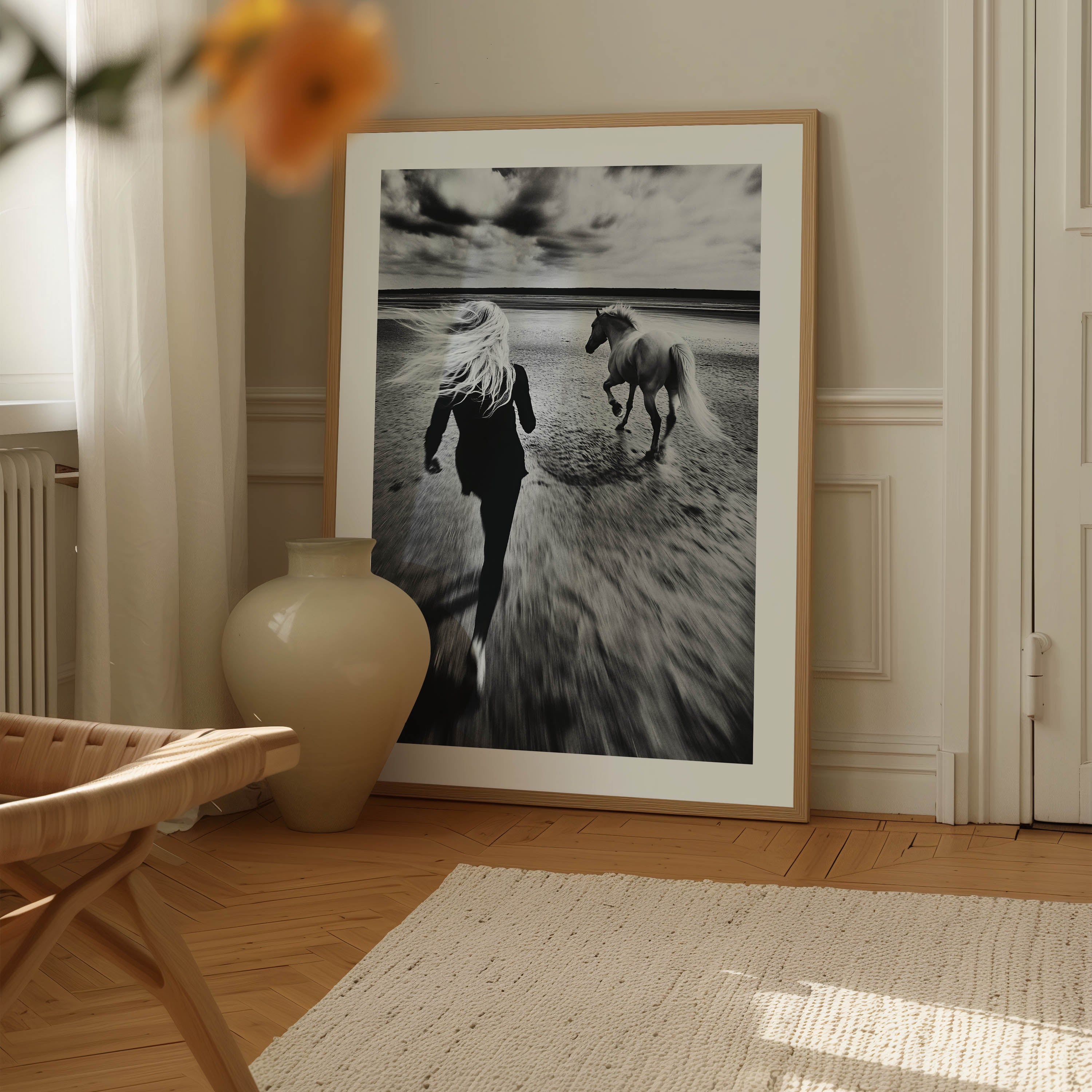 Black and white fine art print of a woman running freely alongside her horse on a vast, empty beach. The image exudes a sense of freedom, movement, and serenity, making it a perfect statement piece for modern, minimalist, or bohemian home decor. With its timeless monochrome tones and elegant composition, this artwork adds depth, sophistication, and a touch of nature’s beauty to any interior space.