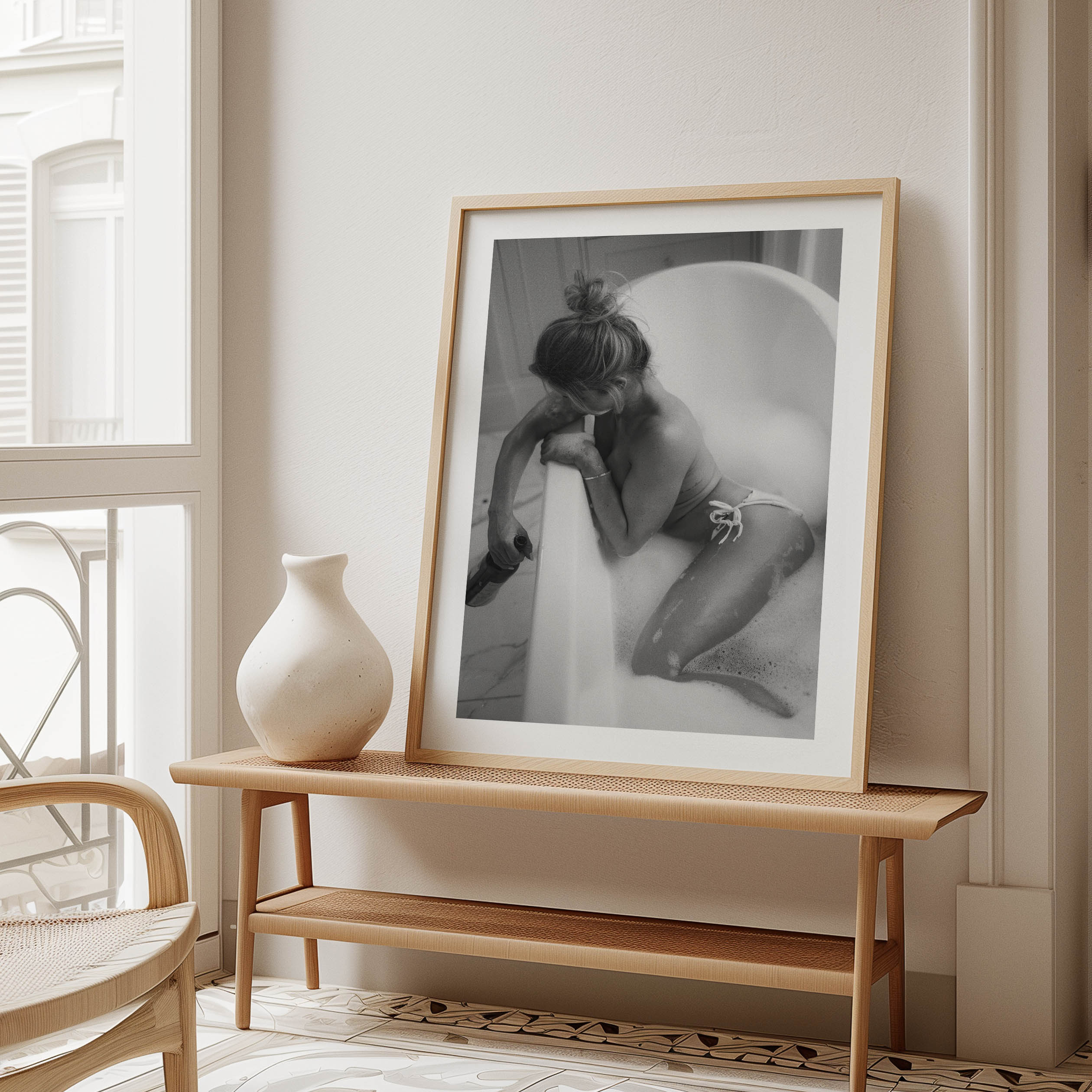 Fine art black-and-white print of a woman in a bathtub. Minimalist, sensual, and elegant — perfect wall art for modern interiors. Museum-quality print