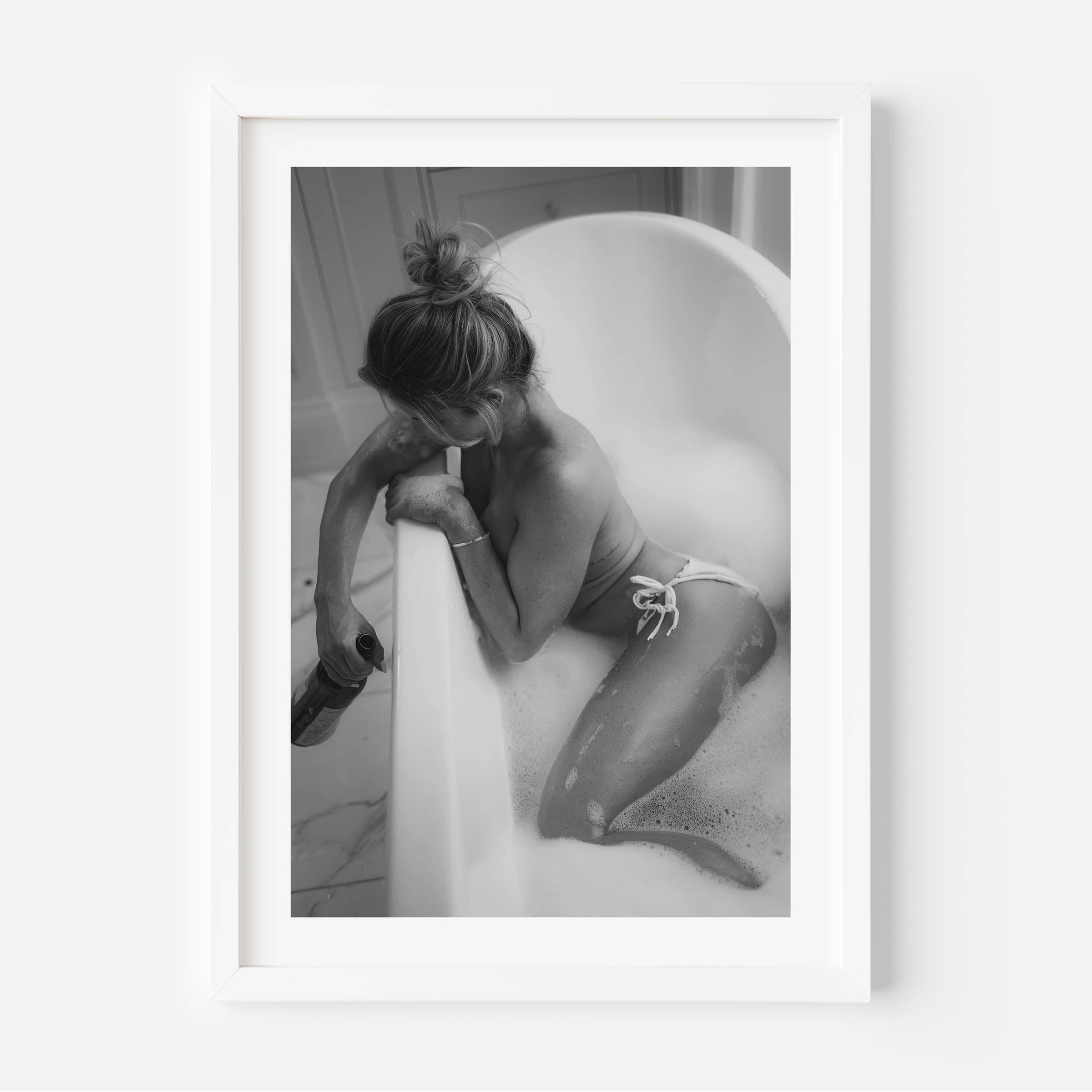 Fine art black-and-white print of a woman in a bathtub. Minimalist, sensual, and elegant — perfect wall art for modern interiors. Museum-quality print