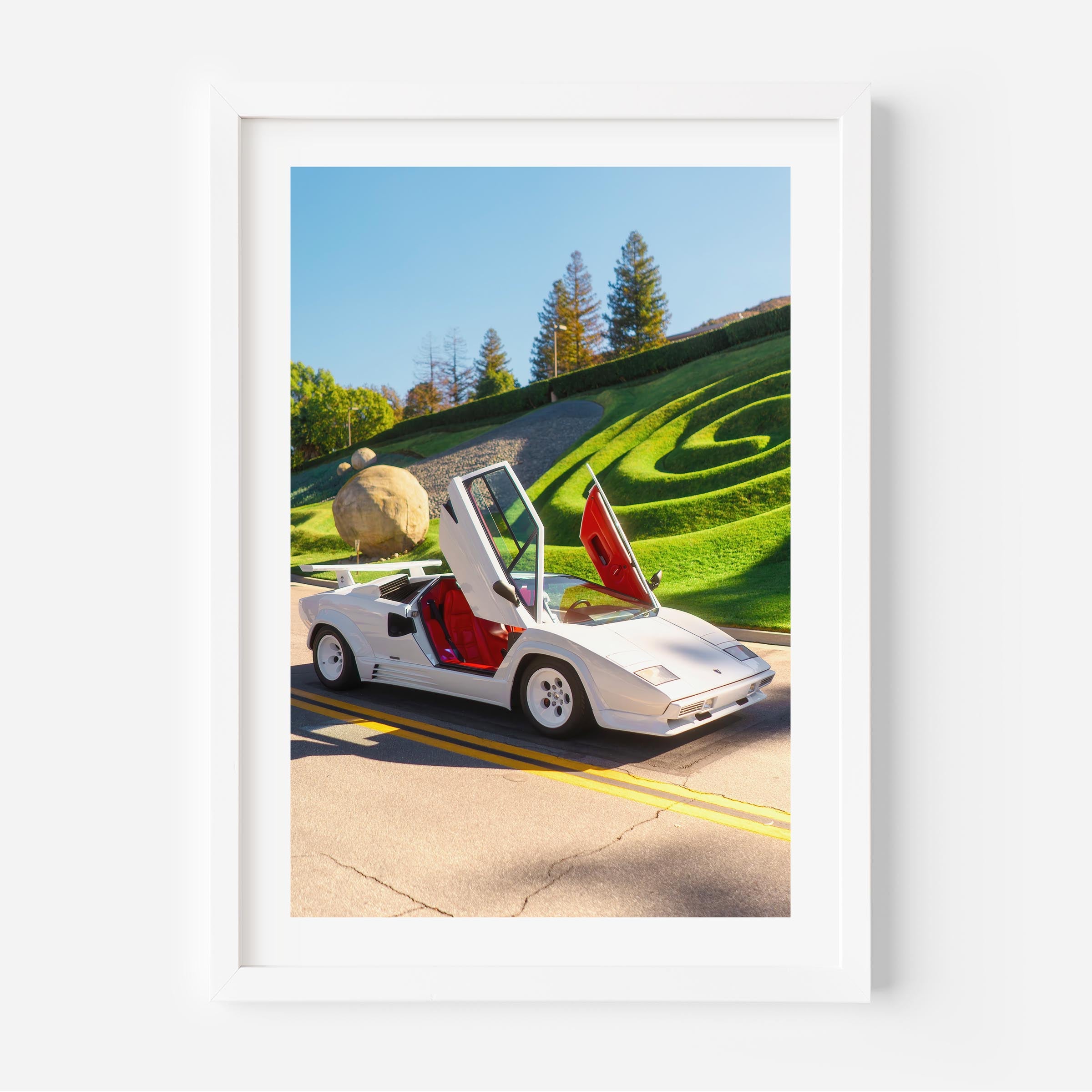 White Lamborghini Countach with scissor doors open – fine art wall print by Deston Isas, retro supercar photography for interiors.