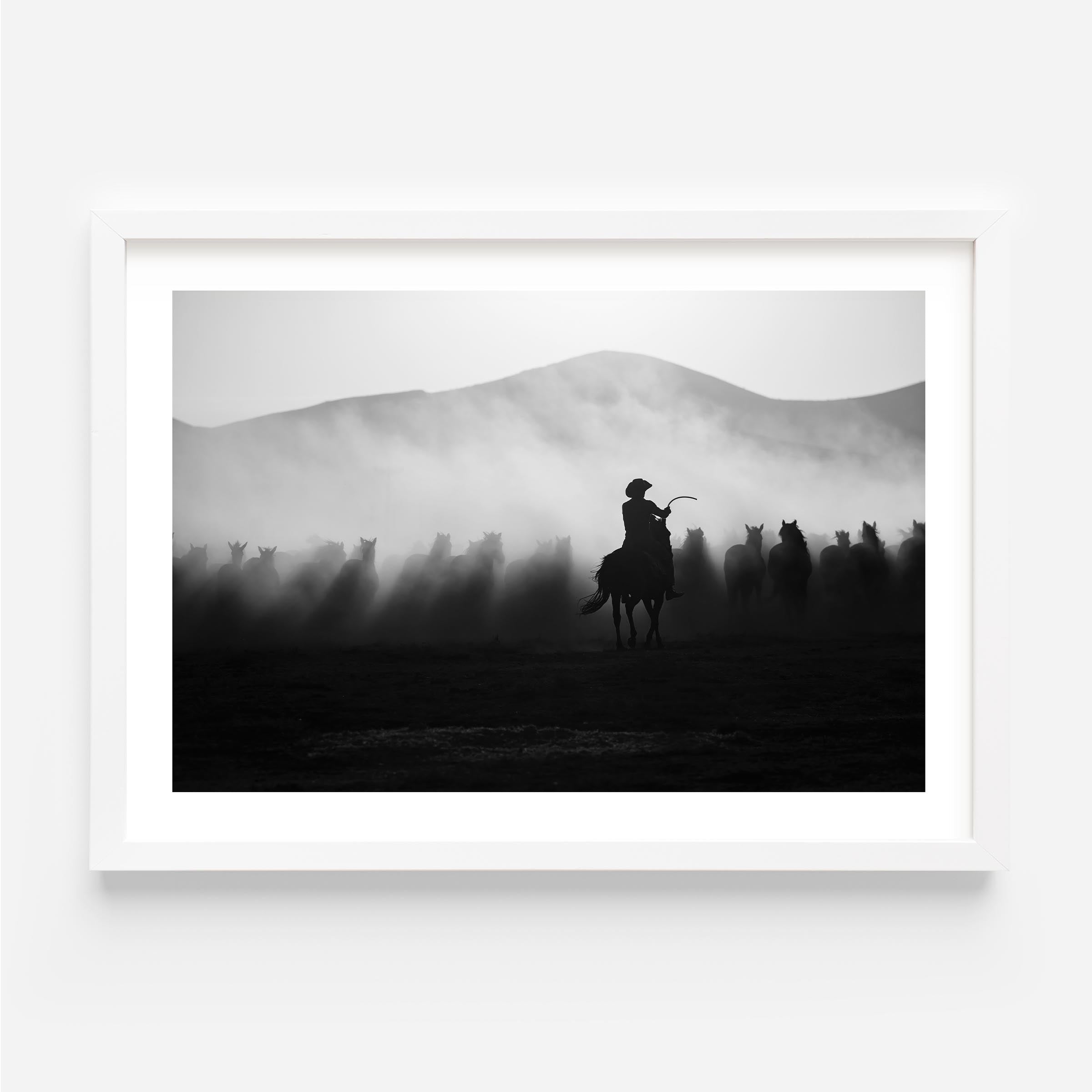 Striking black-and-white cowboy wall art capturing wild horses in motion. Add drama, depth, and Western spirit to your interior with this fine art print.