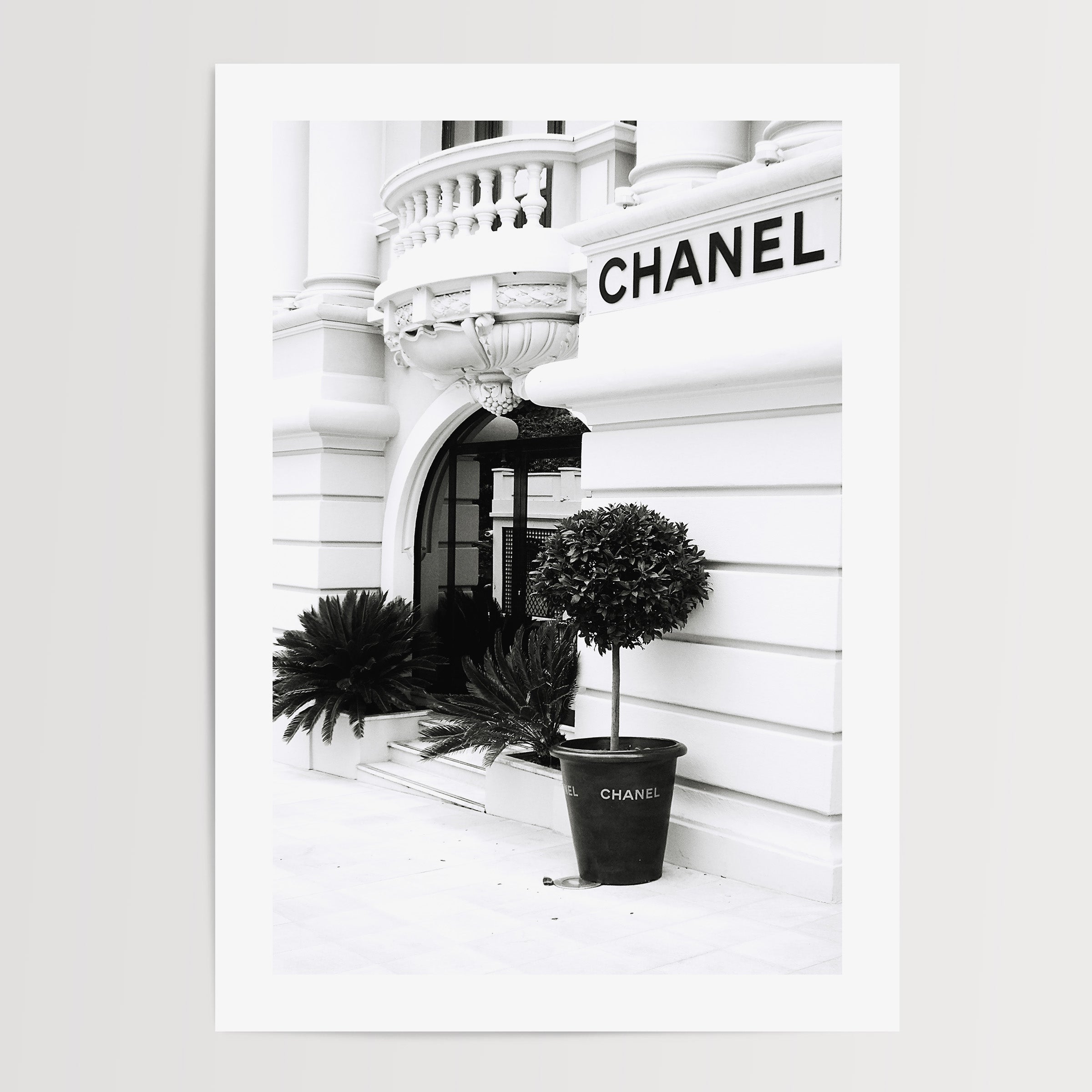 black and white print of the outside of a Chanel store