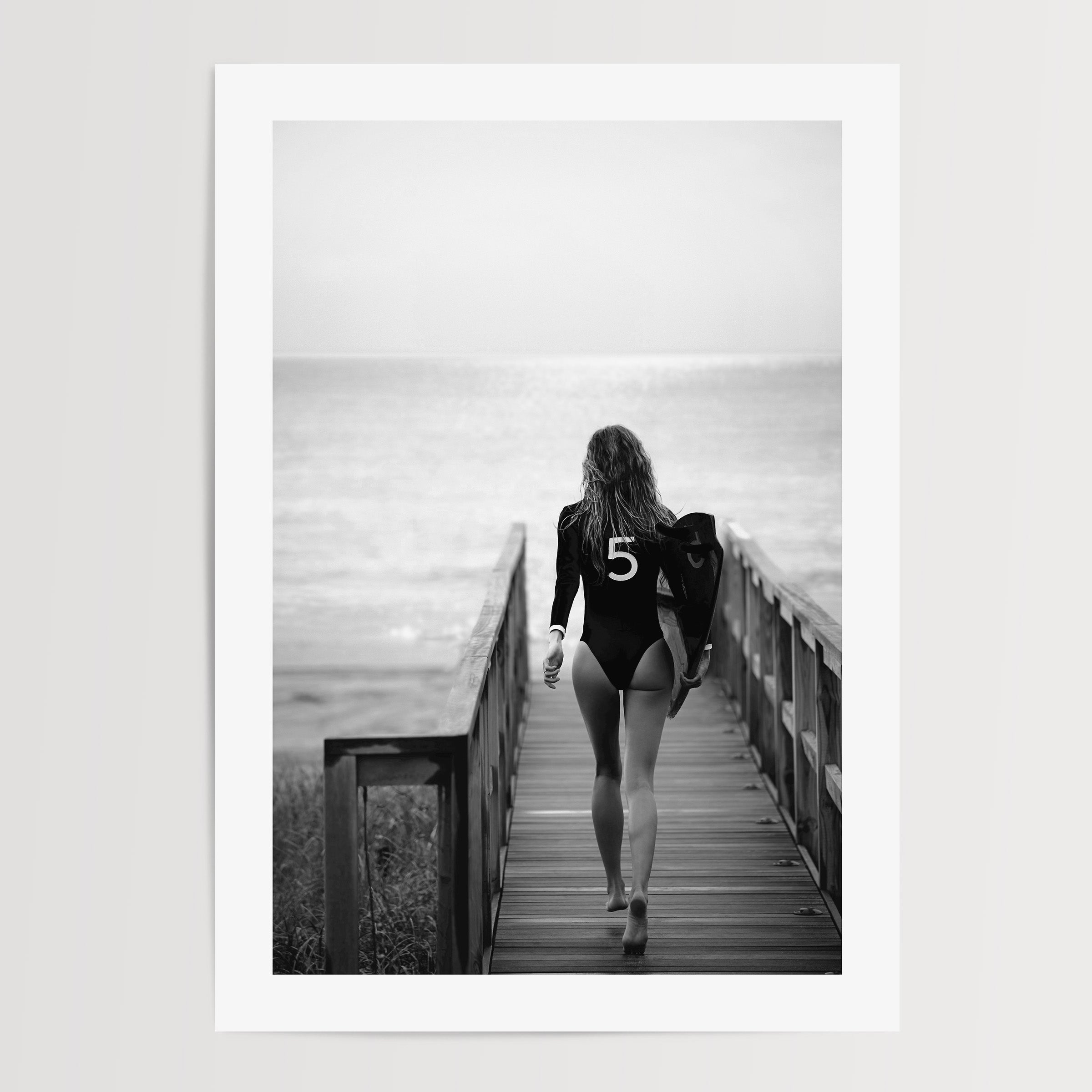 black and white poster of a girl going surfing