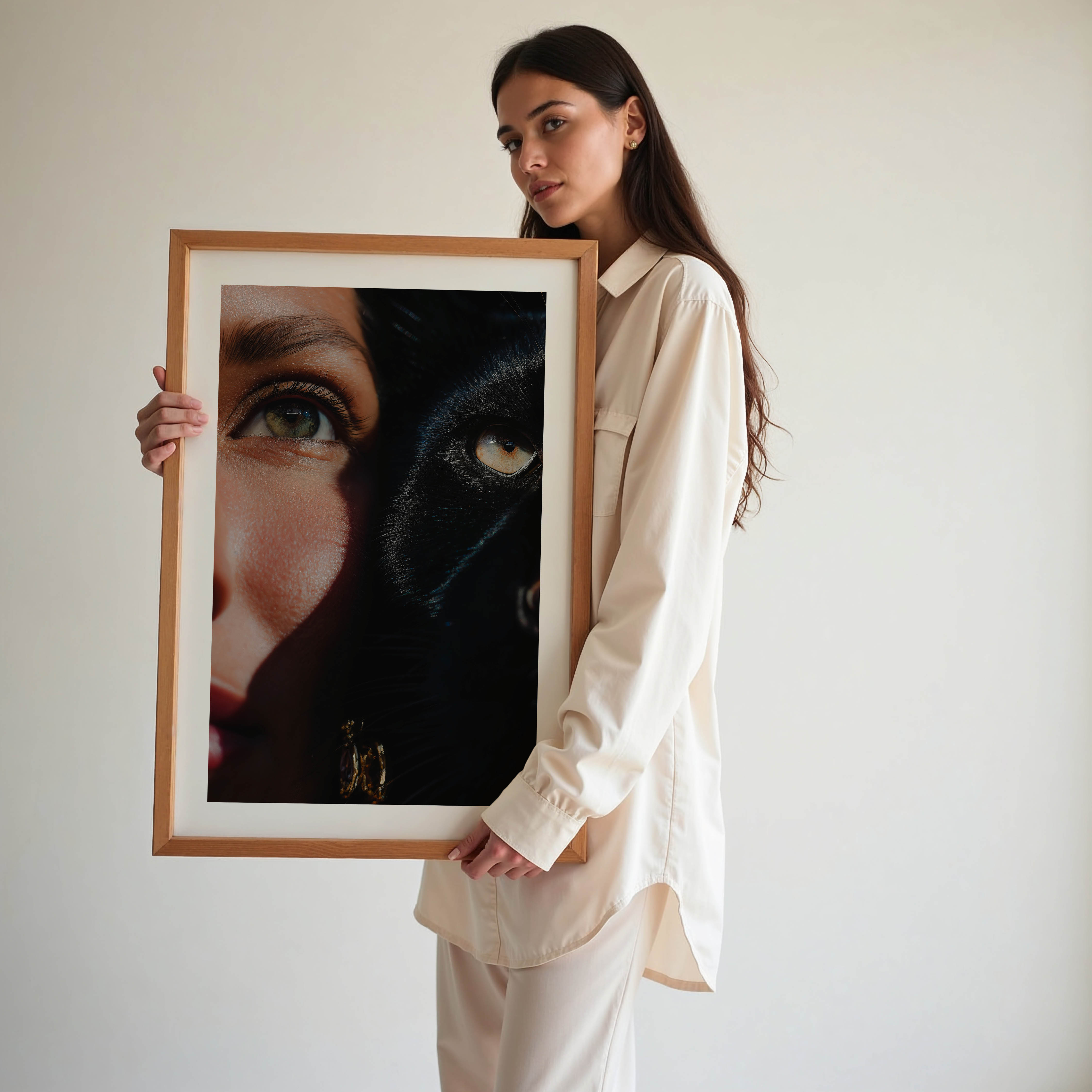 This fine art print features a powerful close-up of a woman and a black cat, their eyes aligned in perfect harmony. The rich shadows and sharp detail create a dramatic, gallery-worthy aesthetic that elevates any modern interior.