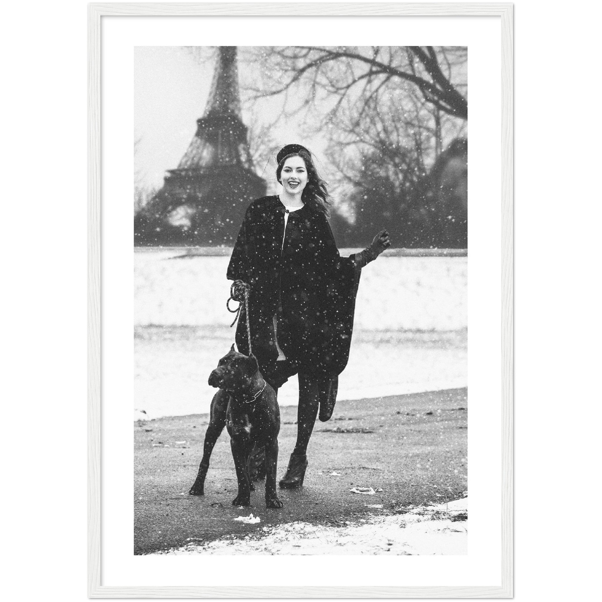 black and white poster of a woman posing with her dog in front of the Eiffel Tower