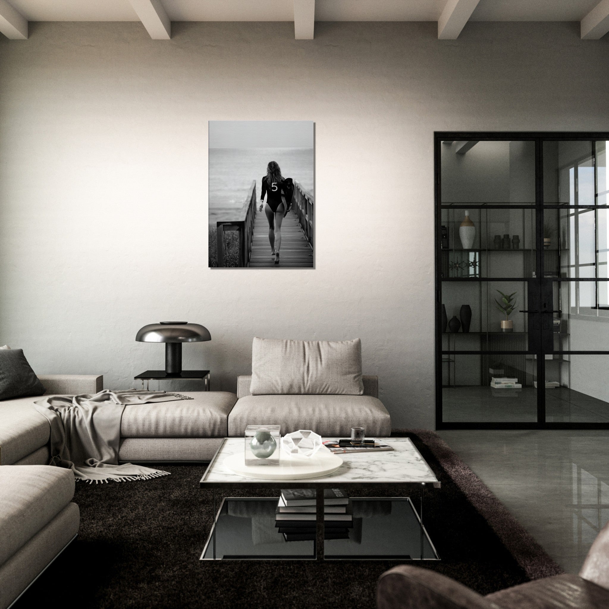 black and white canvas print of a woman in bathing suit ready to go surfing. ther eis a print of the coco chanel nr 5 on the bathing suit