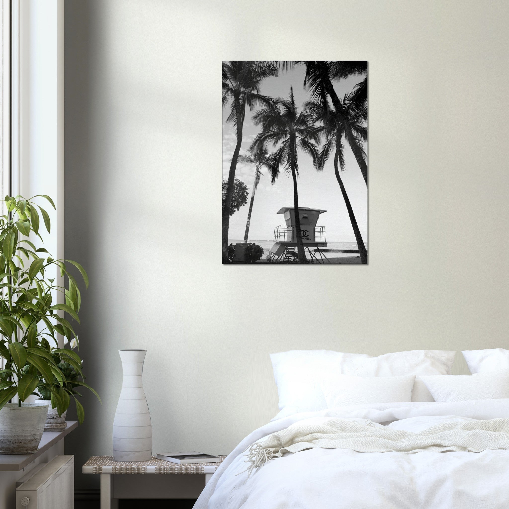 black and whiter canvas print of a chanel lifeguard tower on the beach surrounded by palmtrees