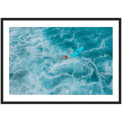 woman swimming with surfboard in clear blue water poster/ wall art