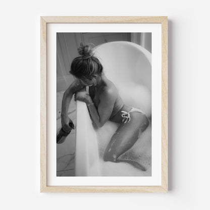 Fine art black-and-white print of a woman in a bathtub. Minimalist, sensual, and elegant — perfect wall art for modern interiors. Museum-quality print