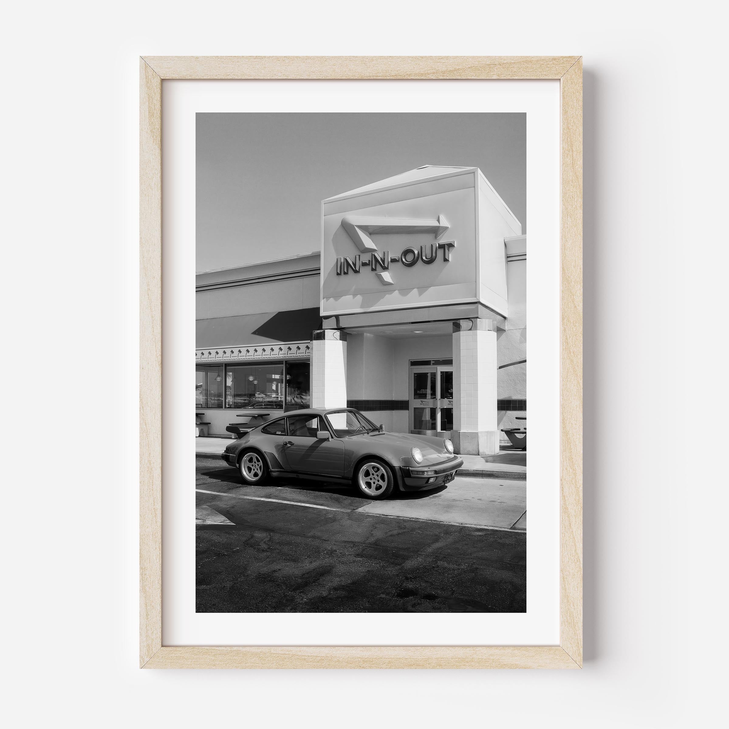 Black and white Porsche parked at In-N-Out – fine art wall print by Deston Isas.