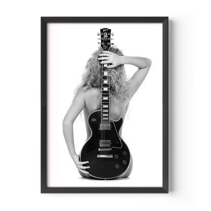 Black-and-white fine art print of a figure from behind holding an electric guitar on a white background.