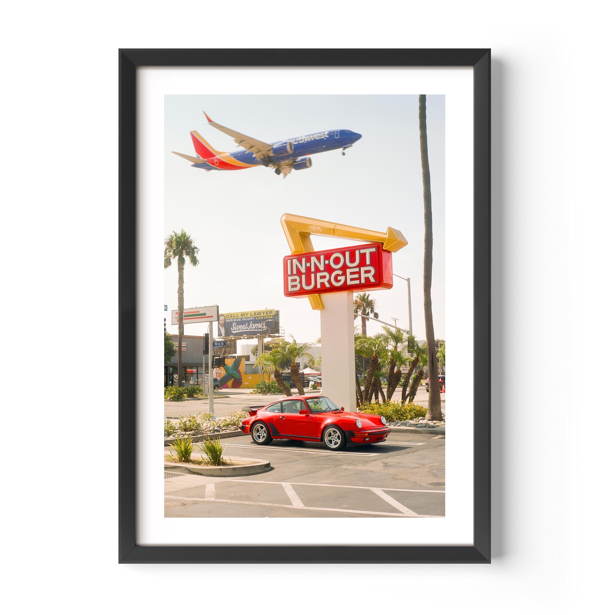 Red Porsche parked at In-N-Out Burger with airplane flying overhead – fine art wall print by Deston Isas