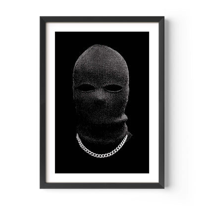 Black-and-white portrait of a person in a knit balaclava with eye cutouts and a silver chain on a solid black background, minimalist fine art print.