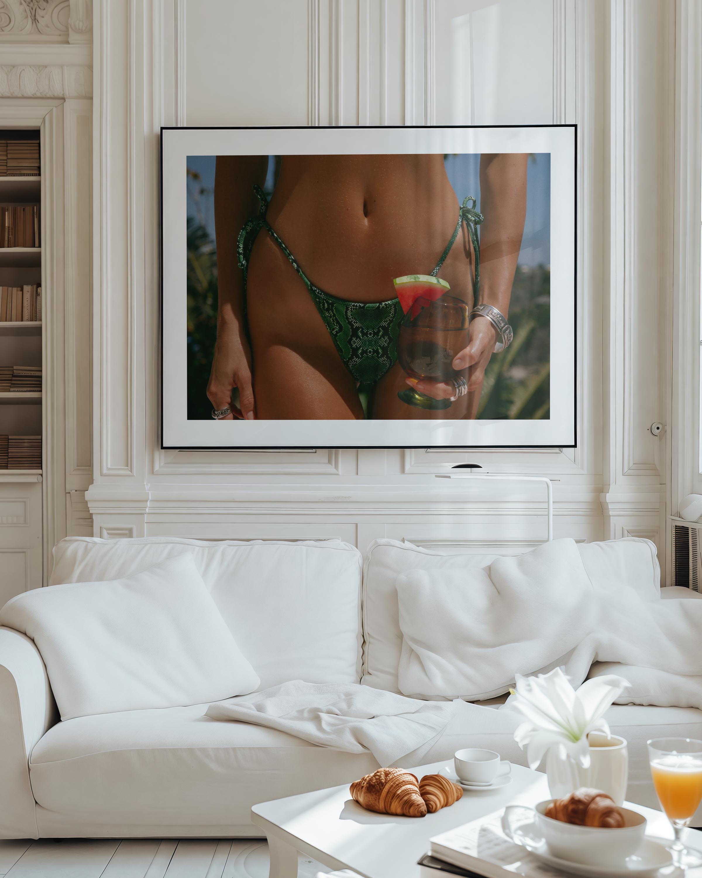 Framed fine-art photograph of a woman in an emerald snakeskin bikini holding a cocktail with a watermelon garnish; summer fashion editorial by Britt Van der Meyden.