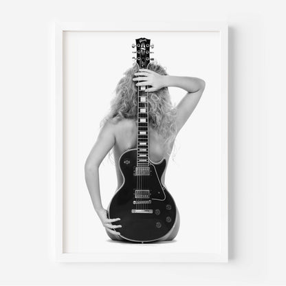 Black-and-white fine art print of a figure from behind holding an electric guitar on a white background.