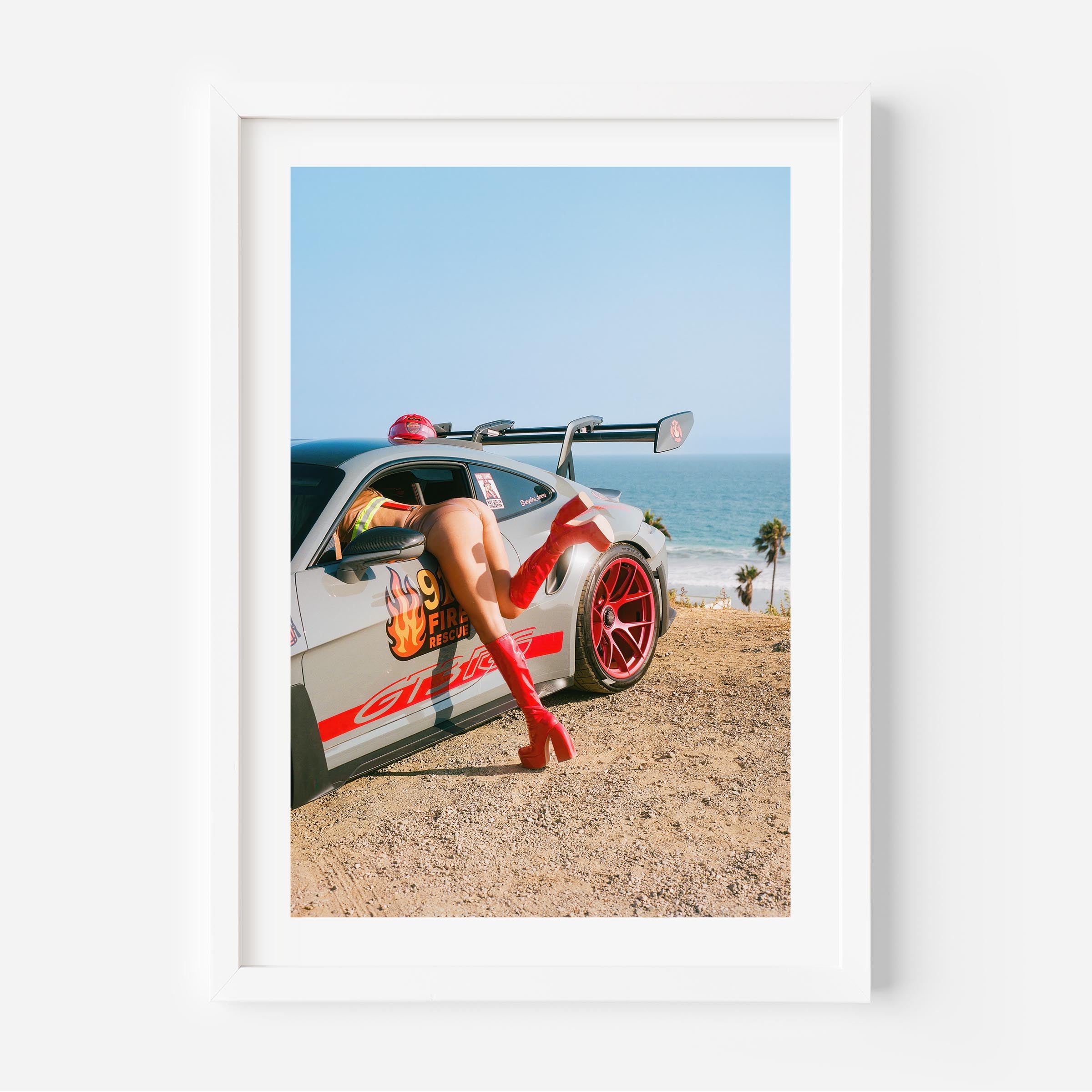 Porsche GT3 RS fire-rescue with red boots by the ocean – bold fine art wall print by Deston Isas for modern interiors.