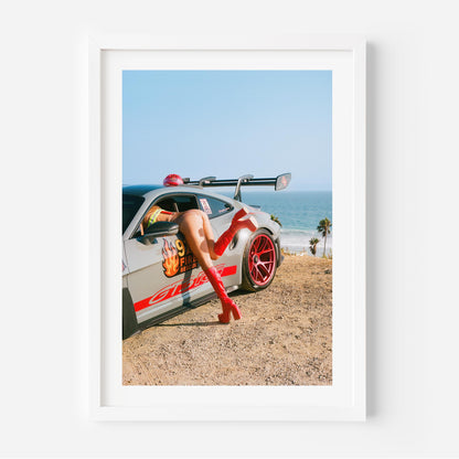 Porsche GT3 RS fire-rescue with red boots by the ocean – bold fine art wall print by Deston Isas for modern interiors.