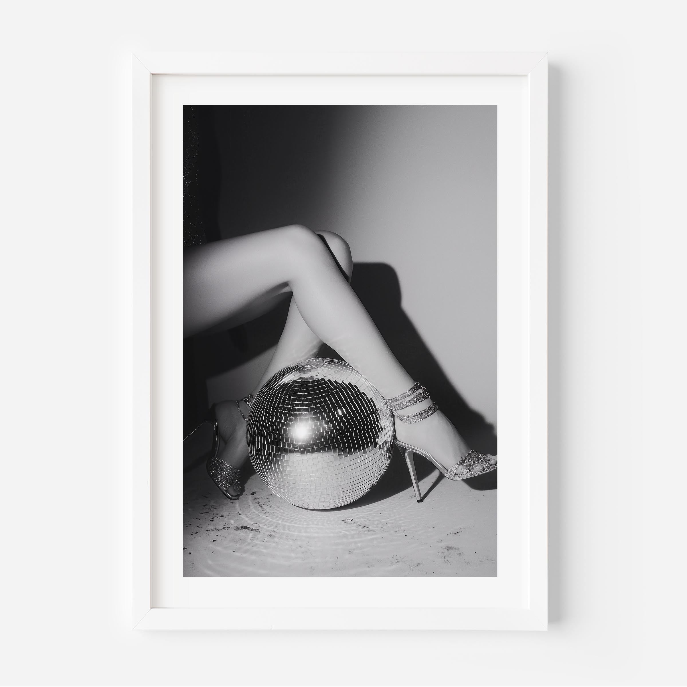 Bring the party home with this glamorous black-and-white fine art print featuring glittering heels and a disco ball. Perfect for bold, stylish interiors.
