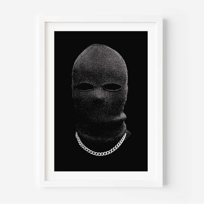 Black-and-white portrait of a person in a knit balaclava with eye cutouts and a silver chain on a solid black background, minimalist fine art print.