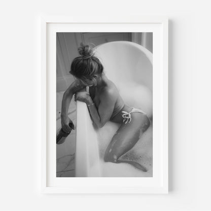 Fine art black-and-white print of a woman in a bathtub. Minimalist, sensual, and elegant — perfect wall art for modern interiors. Museum-quality print