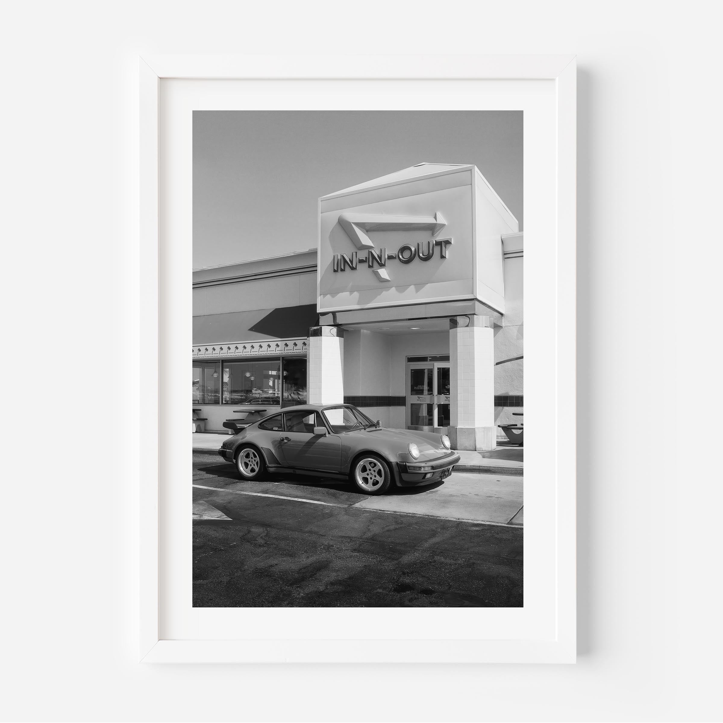 Black and white Porsche parked at In-N-Out – fine art wall print by Deston Isas.