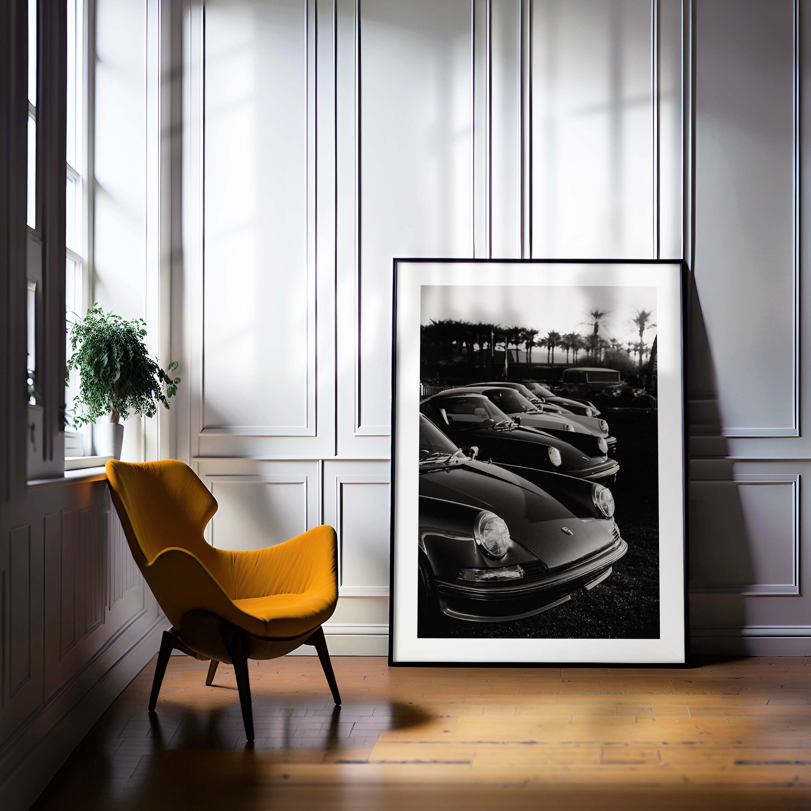 Black-and-white photo print of a row of classic Porsche 911 sports cars parked with palm trees in the background.