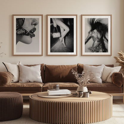 Black-and-white fine art photograph of a woman’s legs in high heels and sequin dress, holding a glittering handbag on a city sidewalk.