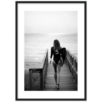 black and white poster of a girl going surfing